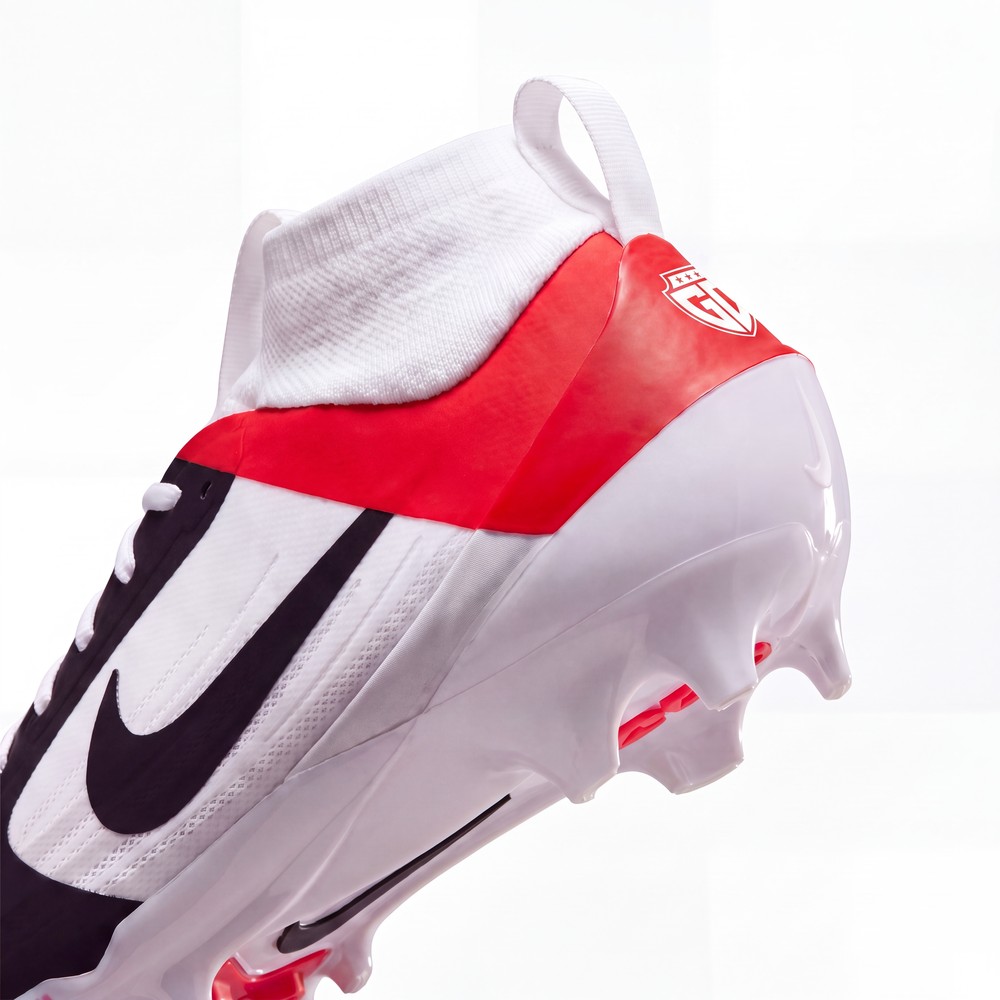 Shield emblem stamped on the heel of a Gameday custom cleat